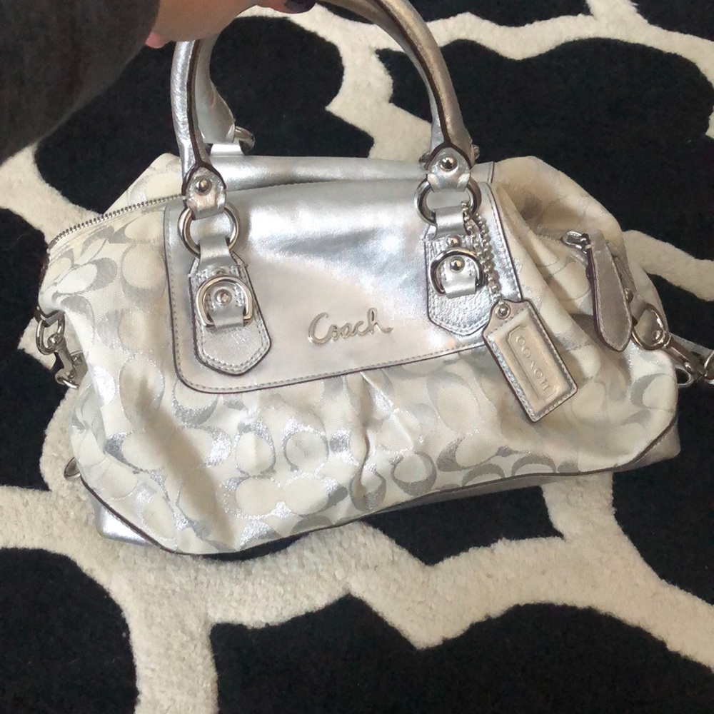 Silver and white coach purse